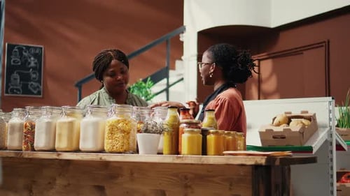 Women Selecting Products in a Refill Grocery Store