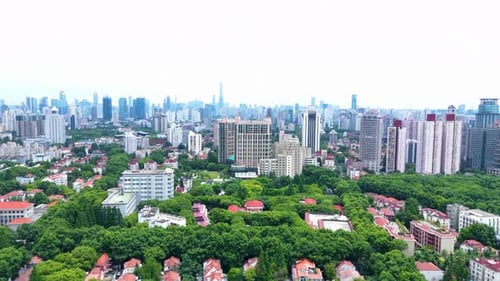 Drone forward shot of Shanghai city with city view and skyline in the background. Skyscrapers scener