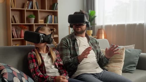 Father and Child Exploring VR Together at Home