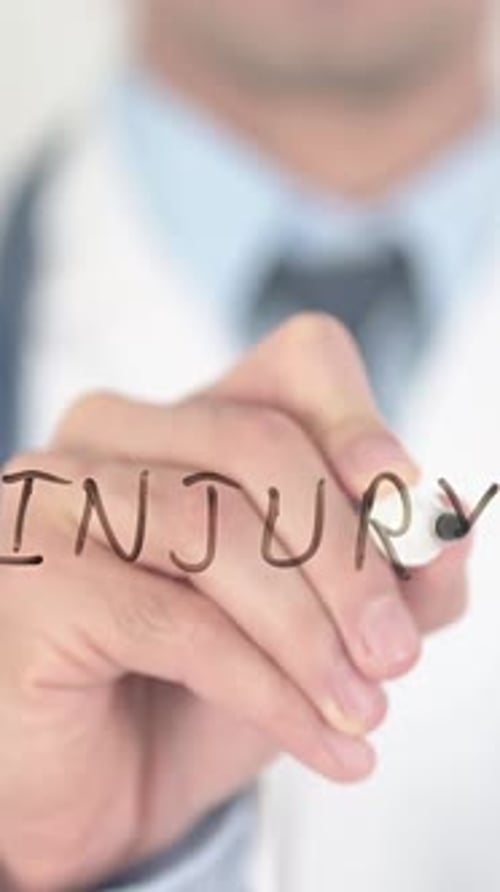 Doctor Writes Injury on Glass Screen in Portrait