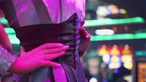 Shiny Dresses and Corset Belts in Neon Bar