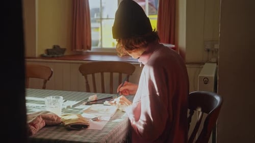 Young Adult Painting with Watercolors at Home