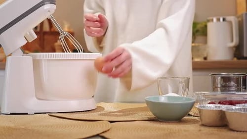 Pastry Chef Adding Ingredients Into Stand Mixer