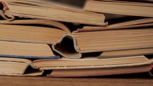 Stack of Old Books Close Up with Worn Pages and Vintage Texture