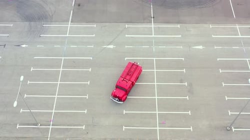 Aerial of Red Fire Truck Stationary in Parking Lot