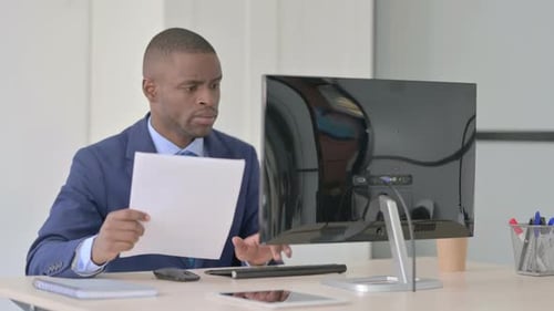 Adult Typing at Computer in Office