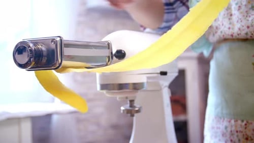 Making Fresh Pasta with Machine in Bright Kitchen