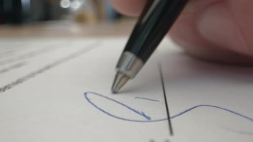 Signature by Pen in Male Hand. Sign Document on Deal at Office