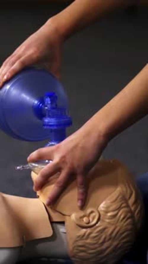 Hands giving CPR on a Medical Training Dummy