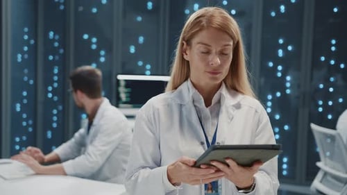 Woman Using Tablet in High Tech Laboratory