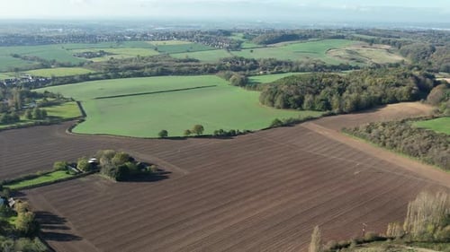 Scenic Aerial View of Rolling Green Rural Landscape