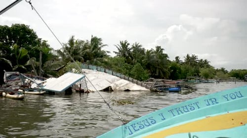 Sailing past capsized boats from tsunami in negombo, sri lanka