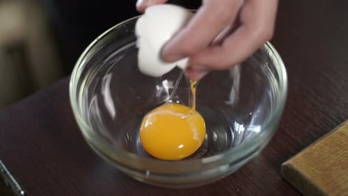 Cracking an Egg into a Glass Bowl
