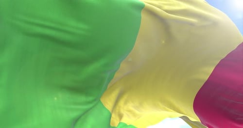 Realistic Mali Flag Waving Against Blue Sky