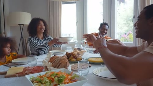 Family Sharing Meal Together at Dining Table