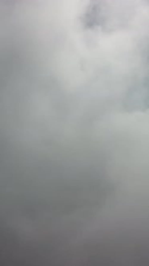 Drone Flies Over Foggy and Fluffy Clouds Aerial Vertical View Blue Sky Sun and Sea Fog Abstract