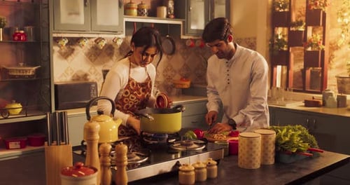 Young Couple Cooking Together in a Cozy Kitchen