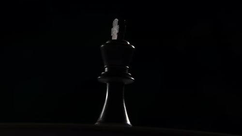 Cinematic shot of a Queen chess piece.