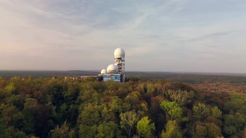 Marvelous aerial view flight of Construction ruin Ruined building in autumn forest at morning sunris