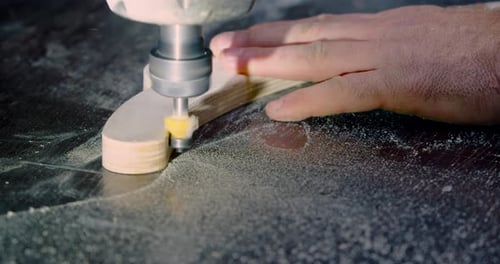 Craftsman Shaping Wood with a CNC Milling Machine