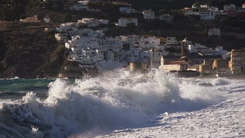 “Crashing Waves Against a Coastal Village