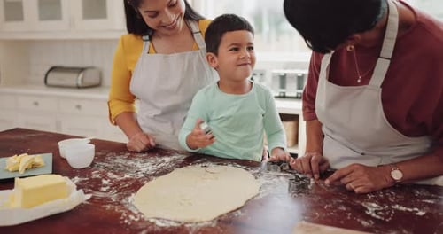 Three People Baking Cookies in Bright Kitchen