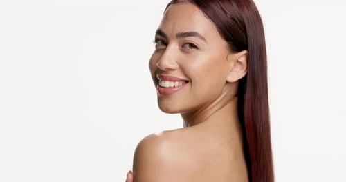 Happy woman, face and shoulder in studio for skincare, smooth touch and skin hydration