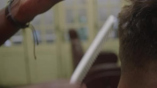 Barber Giving Haircut with Trimmer, Close Up