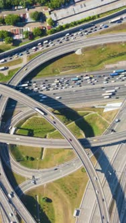 Road Junction and Cars Traffic in Summer Day Flyover Aerial TopDown View Vertical Video