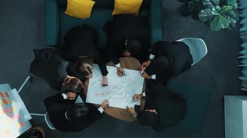 Business Team Brainstorming Mind Map Together in Office