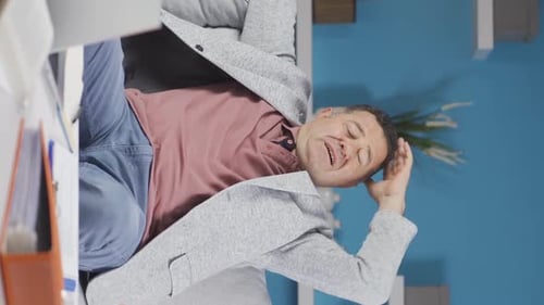 Vertical video of Home office worker old man thinking about private life problems.