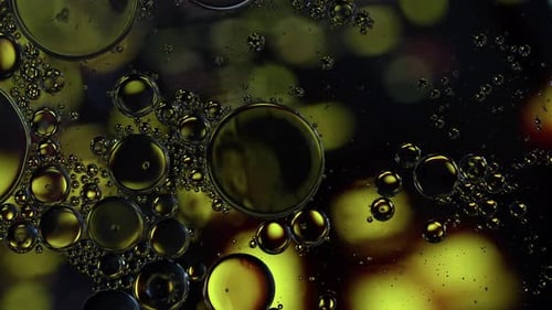 Colorful Oil Bubbles Moving On A Water Surface 071