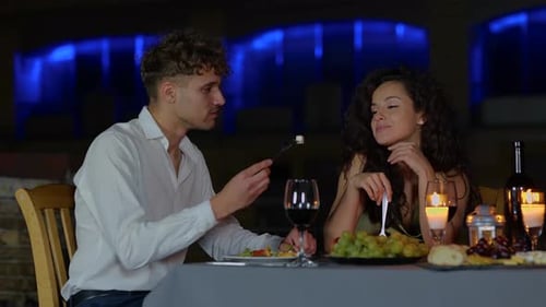 Romantic Couple Enjoying Candlelit Dinner on a Date