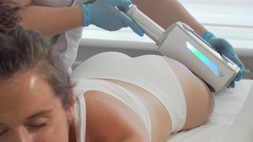 Woman Receiving a Buttocks Massage at a Clinic