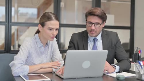 Excited Business People Celebrating Success in Office