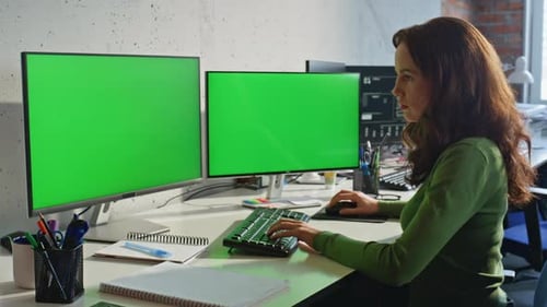 Woman Working on Computer with Green Screen