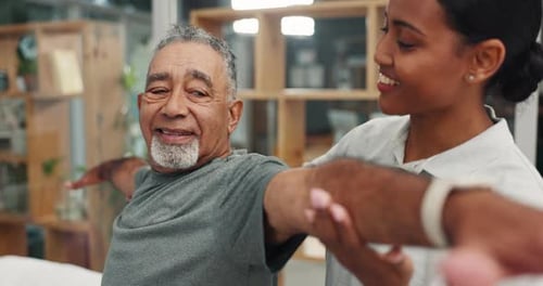 Adult Woman Helping Senior Man Stretch Arms