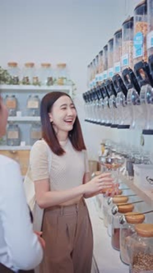 Young woman shopping in a zero waste refill store