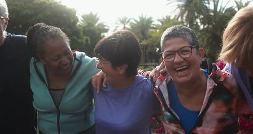 Diverse Friends Laughing Together in Lush Green Park