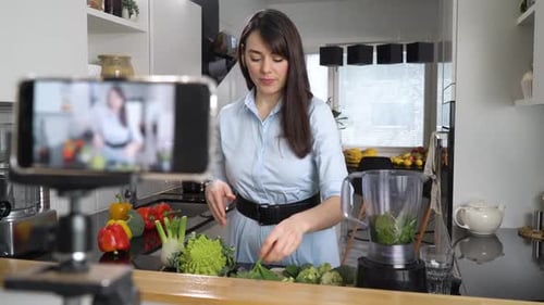 Woman Making Healthy Smoothie in Modern Kitchen
