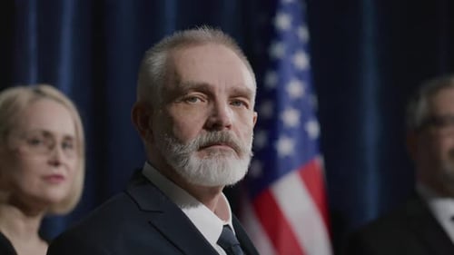 Men and Woman Pose with American Flag