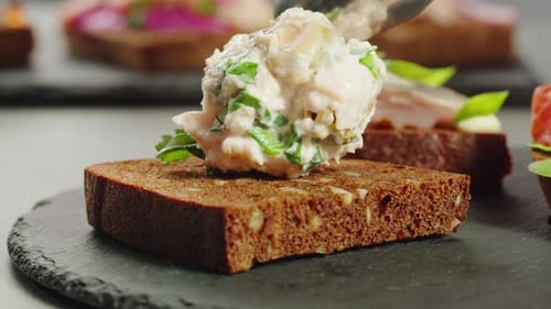 Preparing Appetizers with Bread and Salad at Home