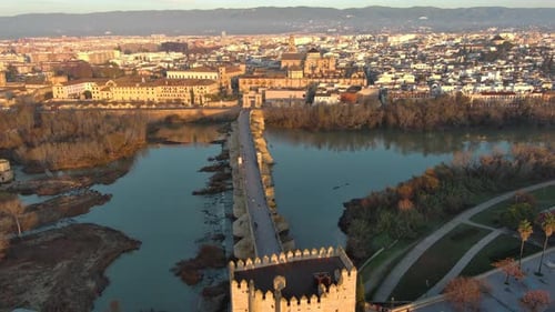 Aerial view of the Mosque-Cathedral of Cordoba and the Roman bridge across the Guadalquivir River