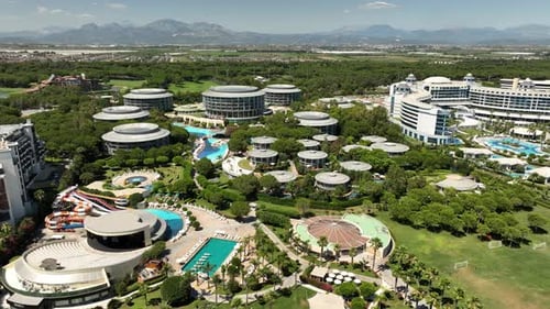 Aerial view of Calista Luxury Resort Hotel with swimming pool, sun beds and round buildings