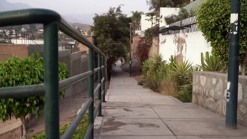Stabilized sliding shot from left to right of the streets in Las Lagunas, La Molina, Lima, Peru