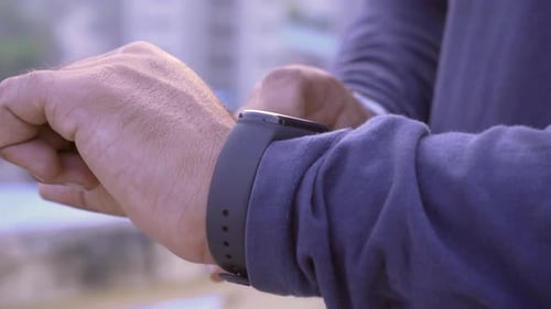 Man Uses Fitness Tracker Digital Watch
