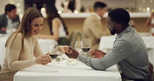 4k video footage of a happy young couple having a romantic date at a fancy restaurant