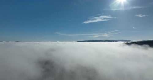 Aerial View of Clouds and Forest Mountains