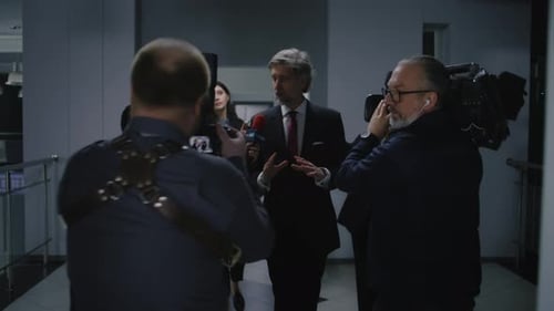 Man Answers Questions at Corporate Press Conference