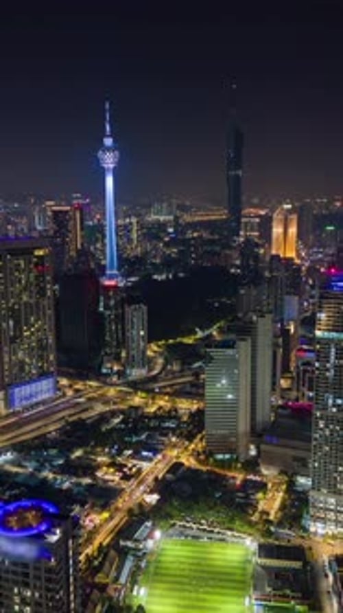 Aerial Night Timelapse of Kuala Lumpur Skyline with Illuminated Skyscrapers